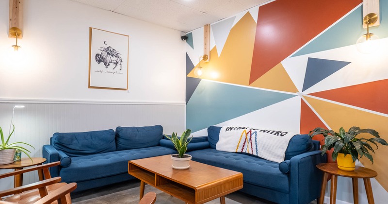 Interior, seating area, coffee table and padded sofas