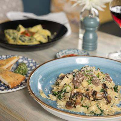 Fettuccine ai Carne e Funghi   house made Fettuccine Beef tenderloin, Mushrooms, and Greens Brandy Cream Sauce.