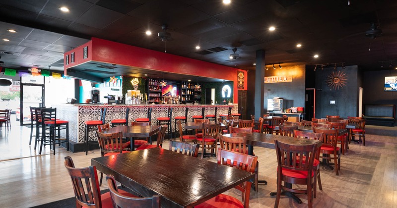 Interior, wide view of dining area, tables and chairs