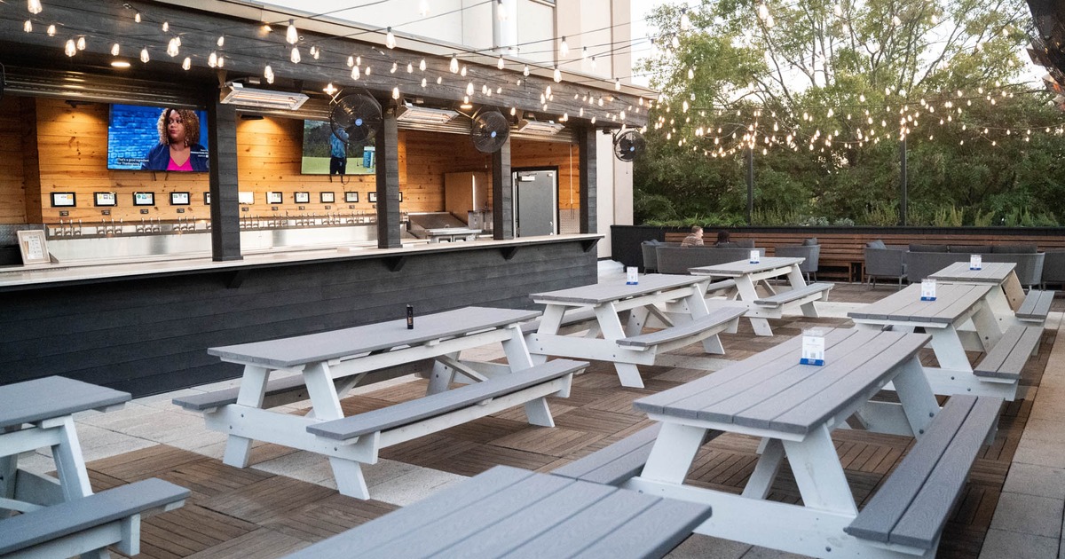 Exterior, open terrace with tables and benches