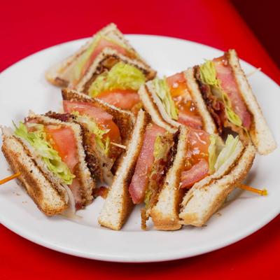 Club sandwich cut in quarters.
