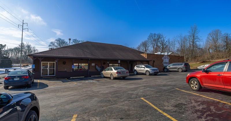 Exterior, front view to restaurant and parking lot