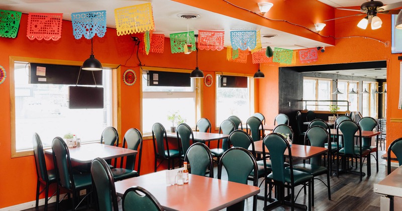 Interior, seating area, tables ready for guests