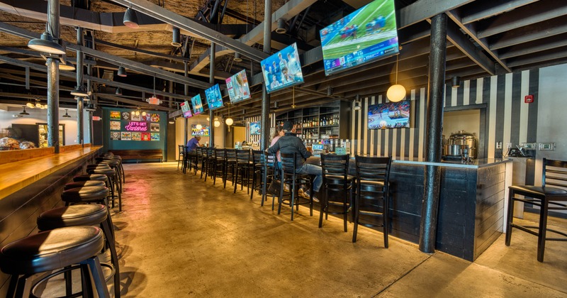 Interior, seating, TVs on the walls