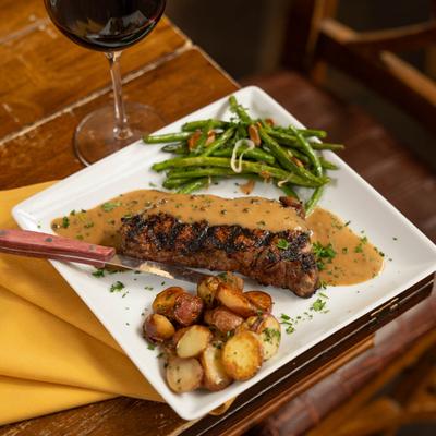 Grilled beef hanger steak and red wine.