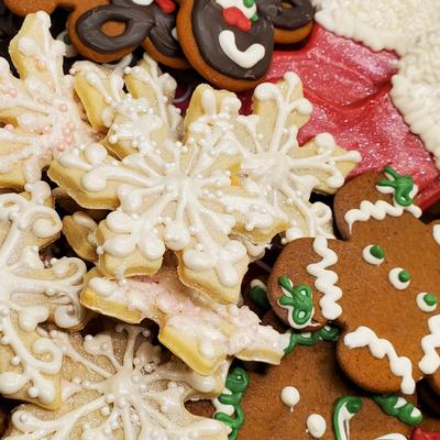 Assorted cookies, white snowflakes, gingerbread men, and chocolate reindeer.