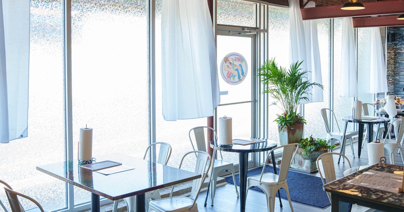 Interior, chairs and tables by the window