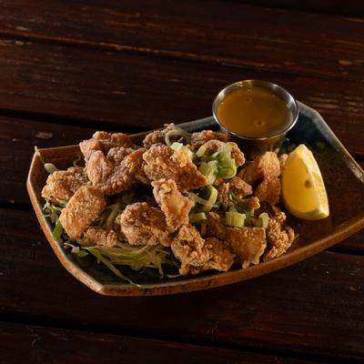 Karaage, crispy fried chicken thigh, lemon, karashi.
