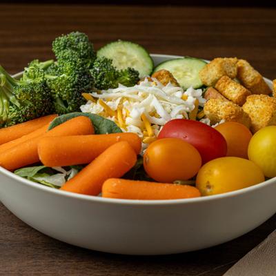 Garden Salad with baby carots, cucamber, cherry tomatoes, croutons and grated cheese.