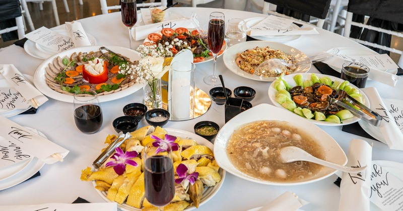 Assorted dishes and drinks arranged on a round dining table