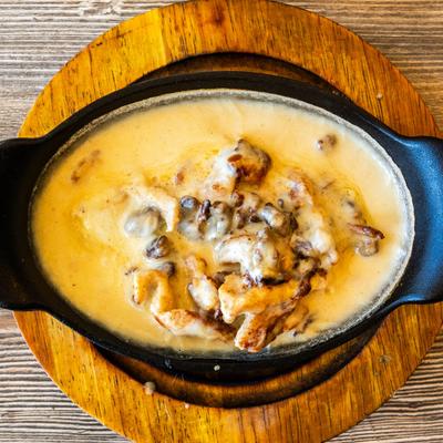 The Pit Bowl with shrimp, steak and chicken topped cheese.