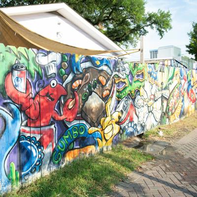 Exterior, graffiti on a fence.