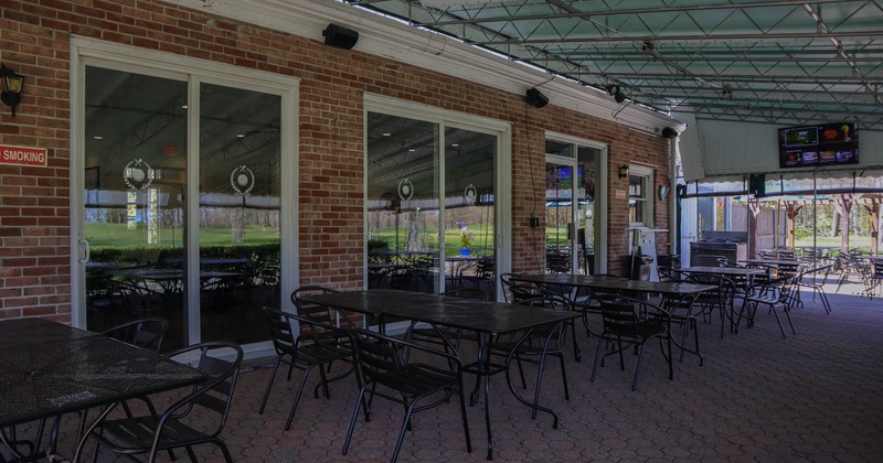 Exterior, covered seating area, tables and chairs