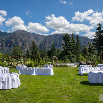 Tables setup for celebration, restaurant grass area