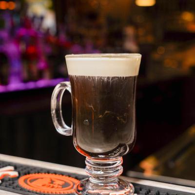 Irish Coffee served on a bar counter.