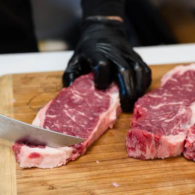 Chef cutting a steak