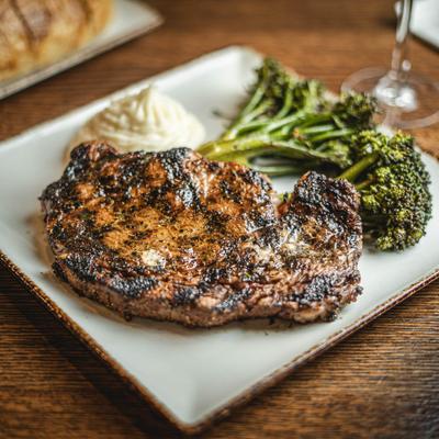 Served ribeye on the plate.
