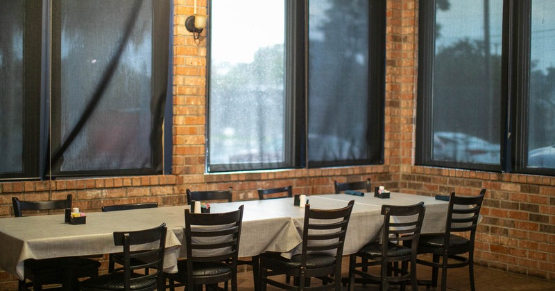 Interior, tables and chairs near windows