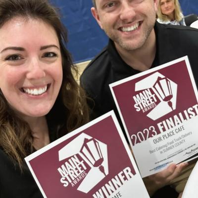 The Owners holding paper awards.