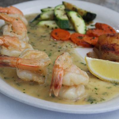 Shrimp in a lemon garlic sauce with mixed vegetables.