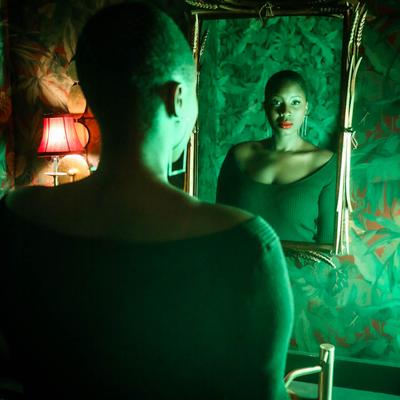 Over the shoulder shot of a staff member standing in front of a mirror.