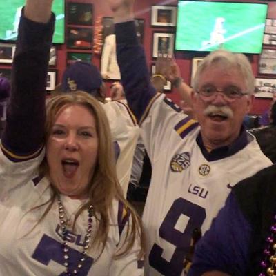 Older guy and a girl cheering