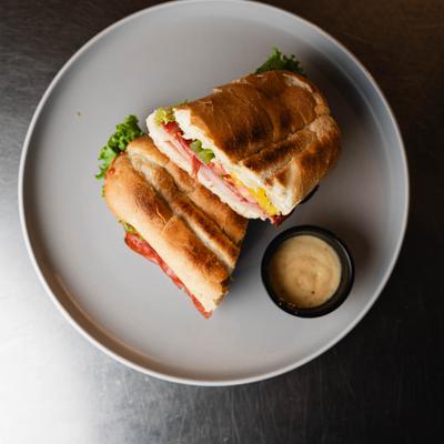 Italian sandwich with dressing on the side.