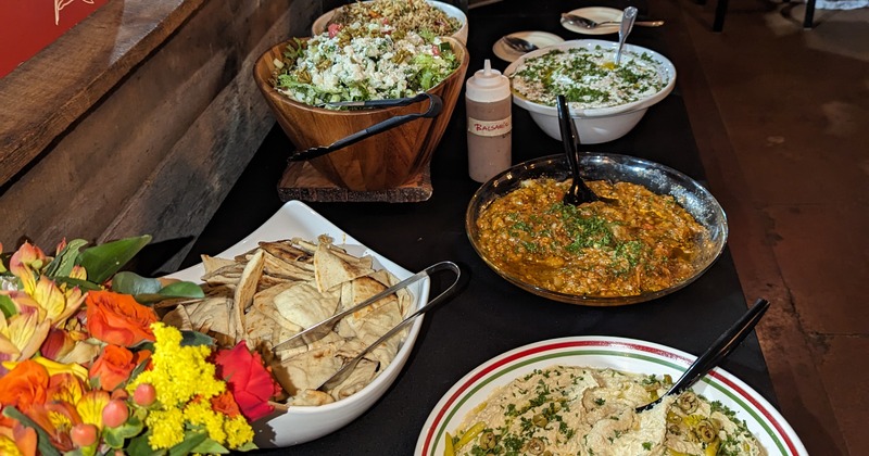 A buffet spread featuring various dishes and salads