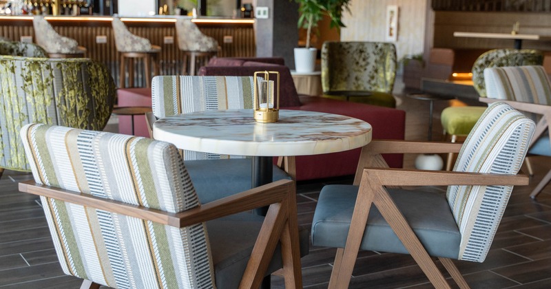 A modern restaurant interior with a round marble table