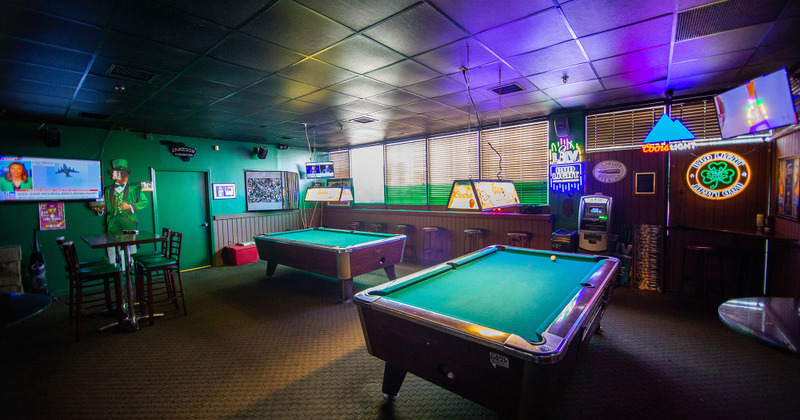 Decorated interior with pool tables