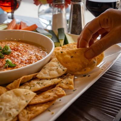 Hummus platter, a guest dining.