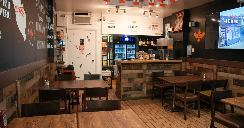 Interior, dining area, tables and chairs ready for guests, checkout counter