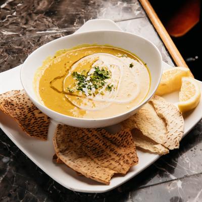 Lentil soup bowl, served with grilled tortilla bread