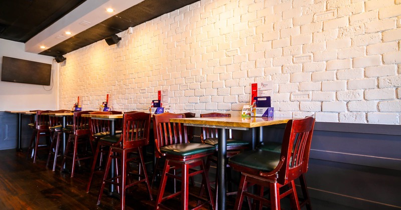 Interior,  seating area with high tables and chairs