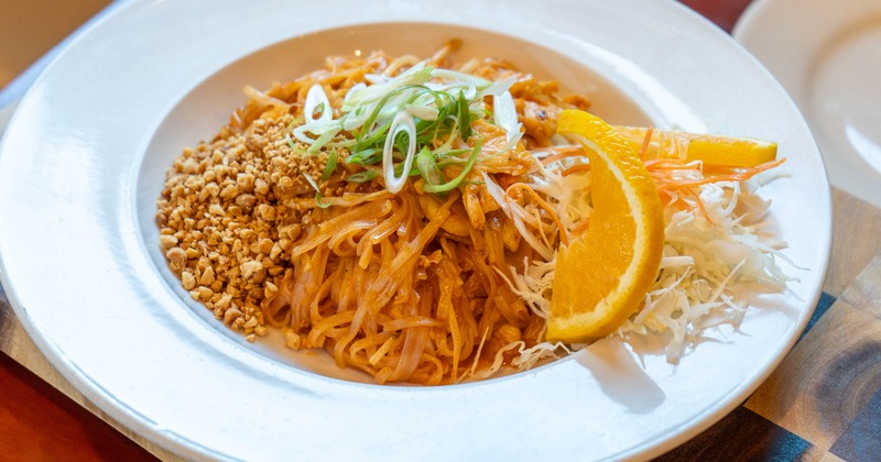 Stir fried noodles with peanuts and scallions