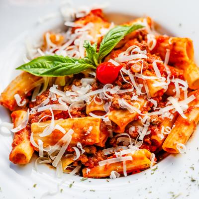 Rigatoni tossed in hearty meat sauce, garnished with shaved cheese and fresh basil.