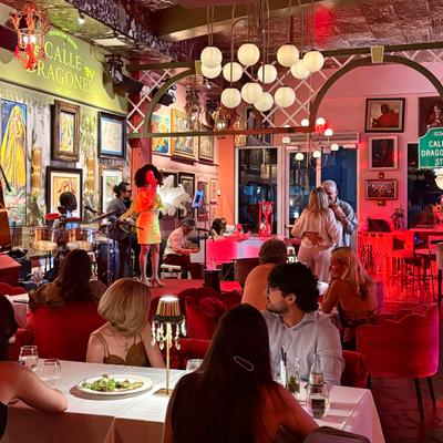 People seated at the table watching the show.