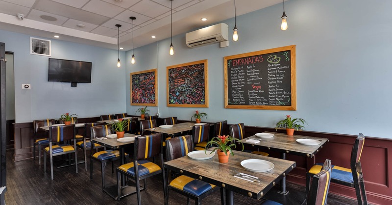 Interior, chairs and tables, TV on the wall