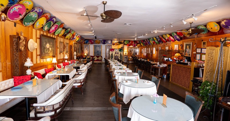 Interior seating area with tables, chairs and sofas
