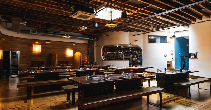 Interior dining space with chairs and benches ready for guests