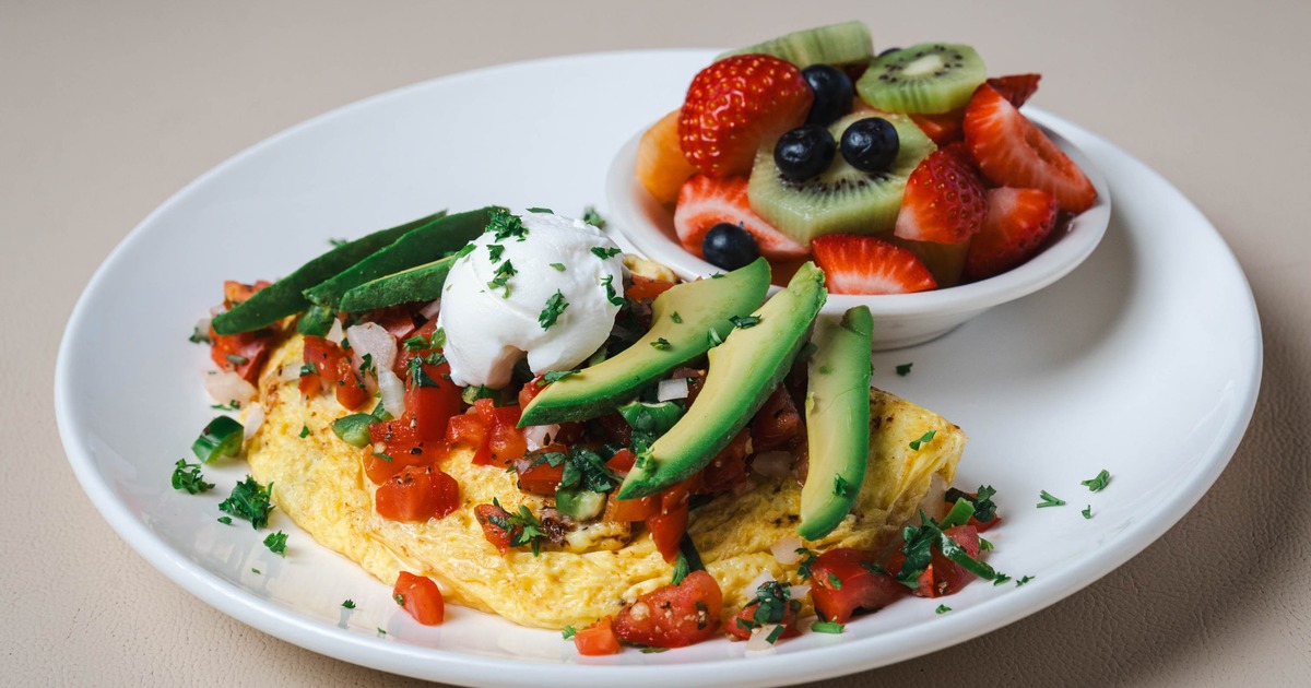House Veggie Omelette served with a cup of fresh fruit