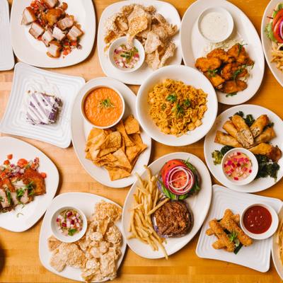 Assorted dishes spread across a wooden table.