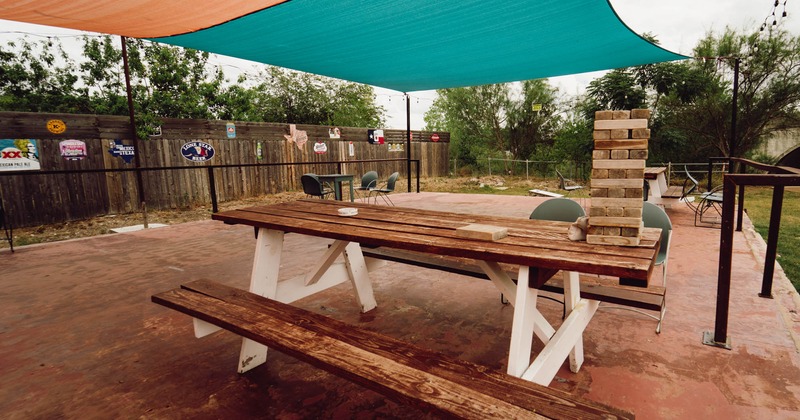 Exterior, patio area covered with sun shade sails, seating