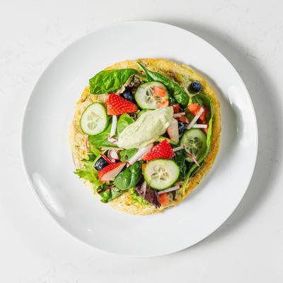Spanish potato omelette, topped with salad.