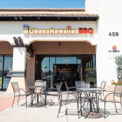 Ohana Hawaiian BBQ  outside, a small seating area with metal tables and chairs.