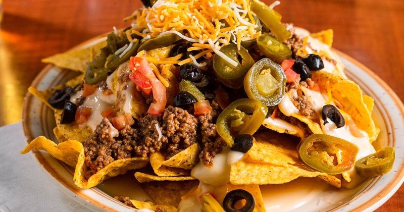 Beef nachos on plate, close up