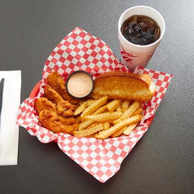 Chicken fingers with crinkle fries, coleslaw, dipping sauce, toasted bread, and a soda drink.