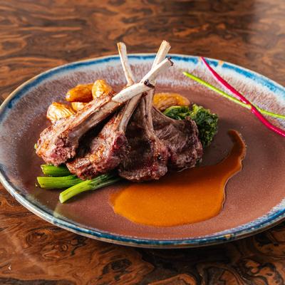 Lamb Chops, rosemary garlic sauce, roasted potatoes, and broccoli rabe.