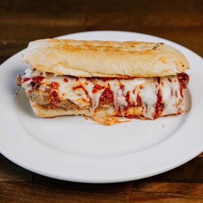 Toasted sub sandwich filled with burger patties, melted cheese, and marinara sauce.