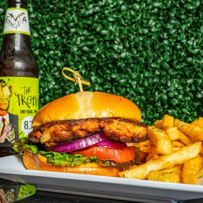 Fried chicken sandwich with fries and the Truth Beer.